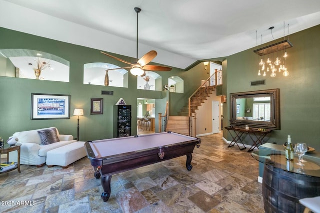 recreation room with ceiling fan, a high ceiling, and pool table