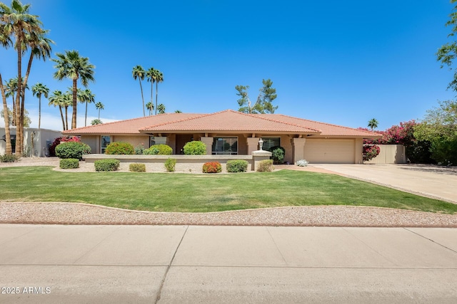 single story home featuring an attached garage, a tiled roof, stucco siding, a front yard, and driveway