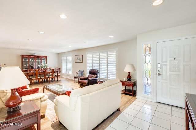 living area with light tile patterned flooring and recessed lighting