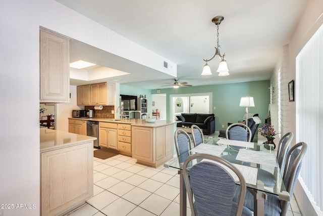 kitchen with light countertops, light tile patterned floors, and light brown cabinets