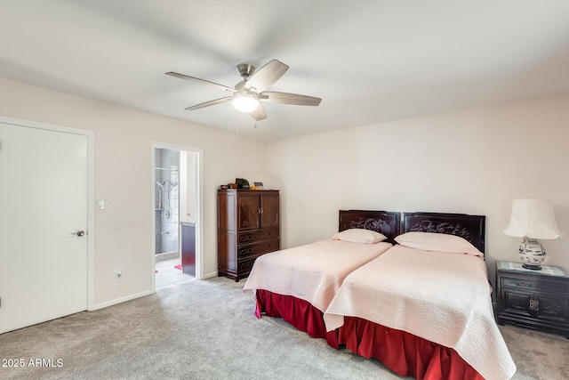 bedroom with baseboards, ensuite bathroom, ceiling fan, and carpet floors