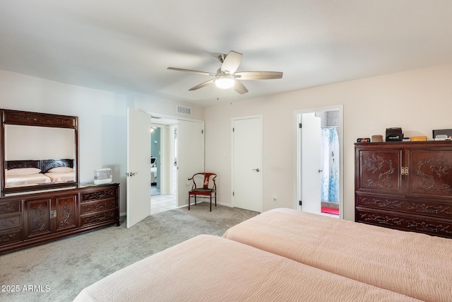 bedroom with a ceiling fan, baseboards, visible vents, and carpet floors