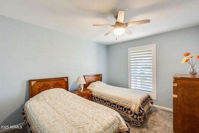 bedroom featuring ceiling fan, carpet, and baseboards
