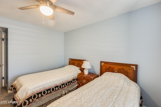 bedroom with a ceiling fan and carpet floors