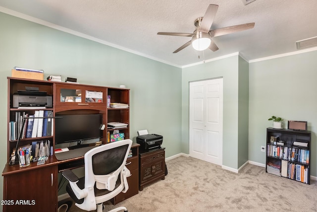 office area featuring carpet flooring, a ceiling fan, crown molding, visible vents, and baseboards