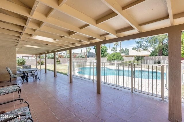 view of swimming pool with outdoor dining area, a patio, a fenced in pool, and a fenced backyard