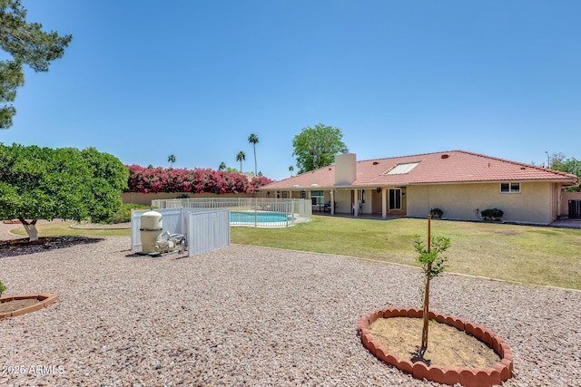 view of yard featuring a patio area, fence, and a fenced in pool