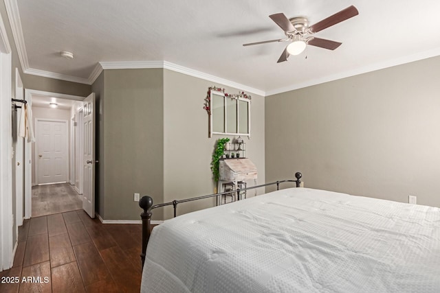 bedroom featuring dark wood-style floors, baseboards, crown molding, and ceiling fan