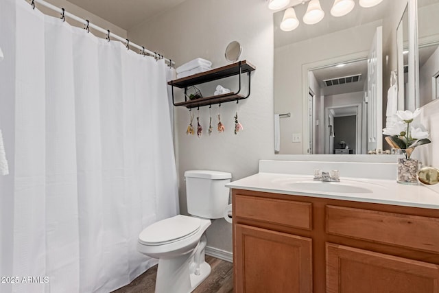 full bath with wood finished floors, toilet, vanity, baseboards, and a shower with curtain
