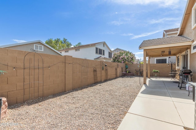fenced backyard featuring a patio area