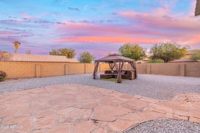 patio terrace at dusk with a gazebo