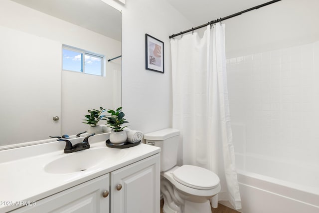 full bathroom featuring vanity, shower / bathtub combination with curtain, and toilet