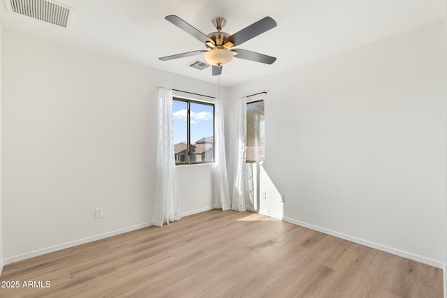 unfurnished room featuring ceiling fan and light hardwood / wood-style floors