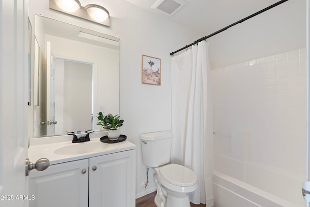 full bathroom featuring vanity, shower / bath combination with curtain, and toilet