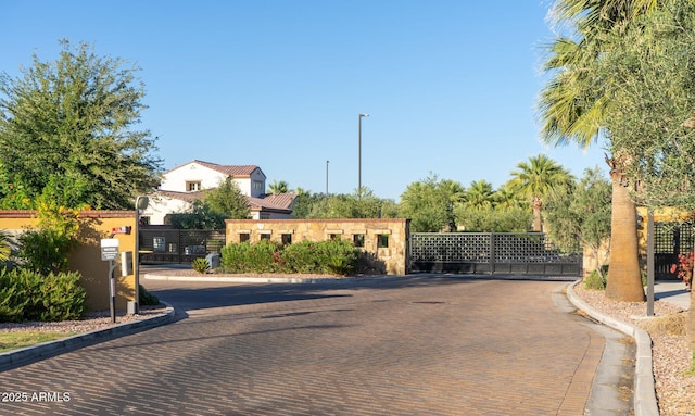 923 W Yellowstone Way, Chandler, AZ 85248 - view of decorative road featuring curbs, a gate, a gated entry, and street lights