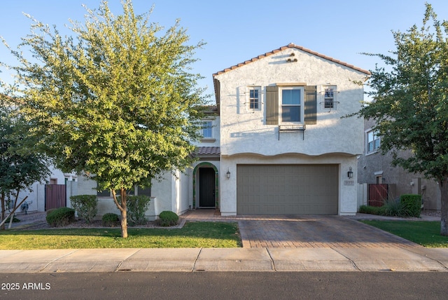 923 W Yellowstone Way, Chandler, AZ 85248 - view of front of home with an attached garage, a tiled roof, stucco siding, and decorative driveway