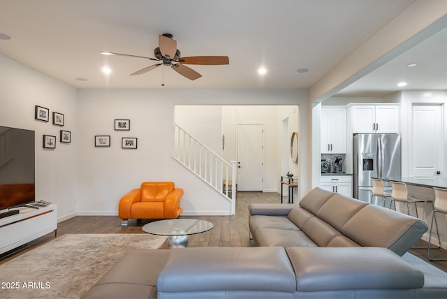 923 W Yellowstone Way, Chandler, AZ 85248 - living area featuring stairs, wood finished floors, a ceiling fan, and recessed lighting