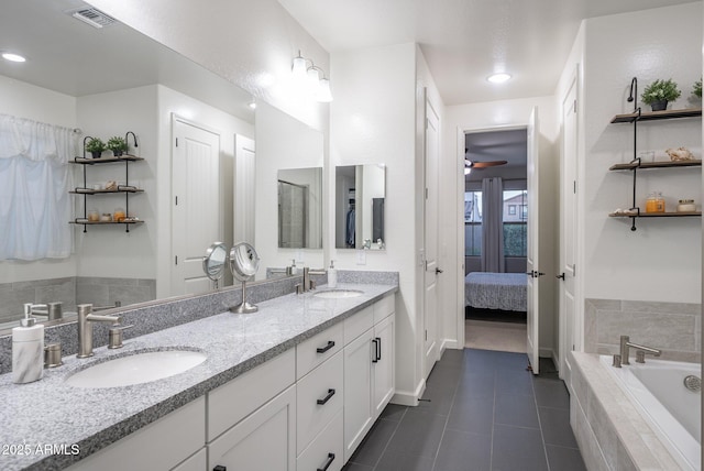 923 W Yellowstone Way, Chandler, AZ 85248 - ensuite bathroom featuring double vanity, a bath, tile patterned flooring, recessed lighting, and ceiling fan