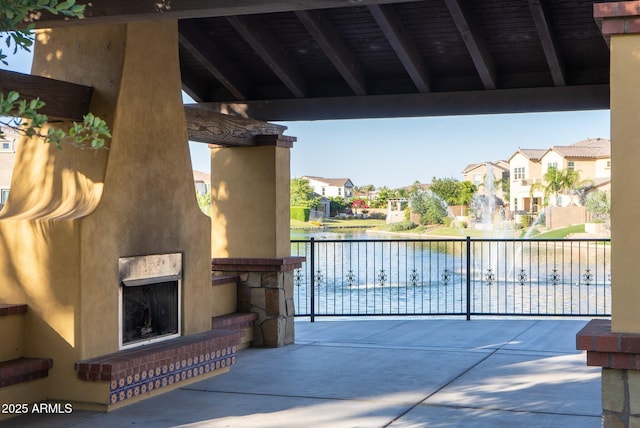 923 W Yellowstone Way, Chandler, AZ 85248 - view of patio with an outdoor fireplace, a residential view, and a water view