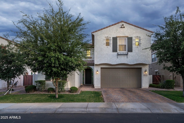 923 W Yellowstone Way, Chandler, AZ 85248 - mediterranean / spanish house with a tile roof, an attached garage, stucco siding, and decorative driveway