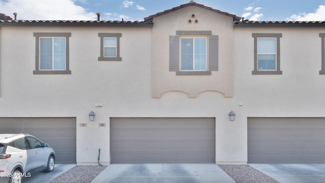 155 N Lakeview Blvd Unit 268, Chandler, AZ 85225 - mediterranean / spanish-style house with a garage, stucco siding, and driveway