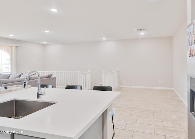 155 N Lakeview Blvd Unit 268, Chandler, AZ 85225 - kitchen with a sink, open floor plan, light countertops, recessed lighting, and baseboards