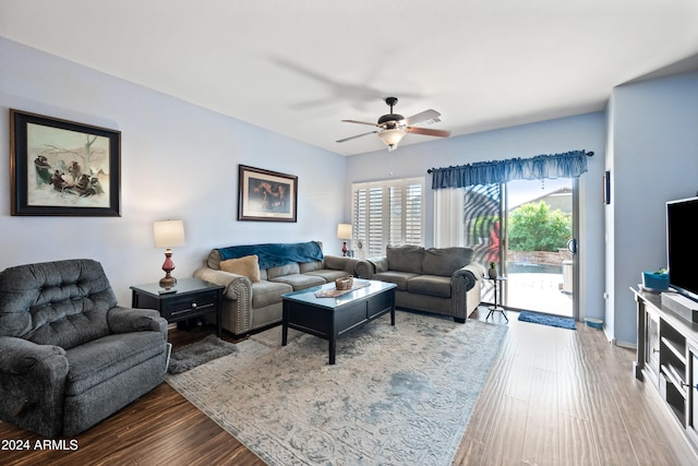 living area with ceiling fan and wood finished floors