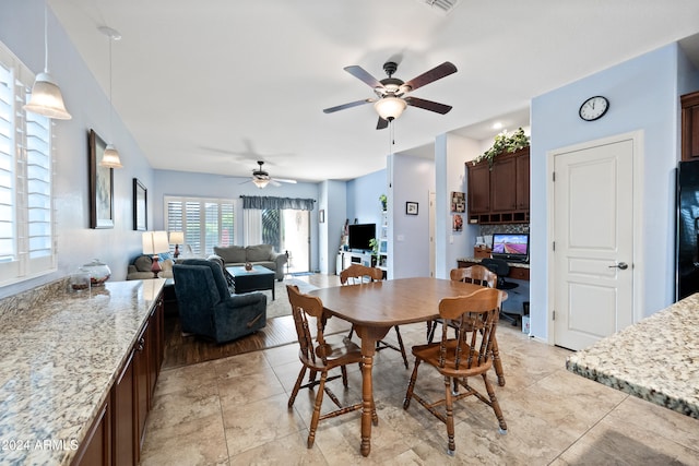 dining area featuring a ceiling fan