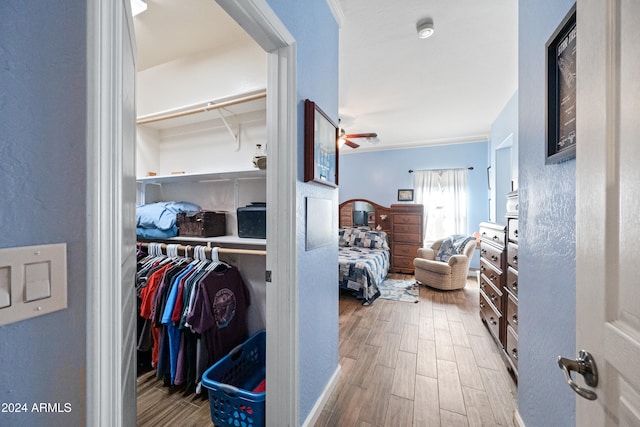 interior space featuring wood tiled floor and crown molding