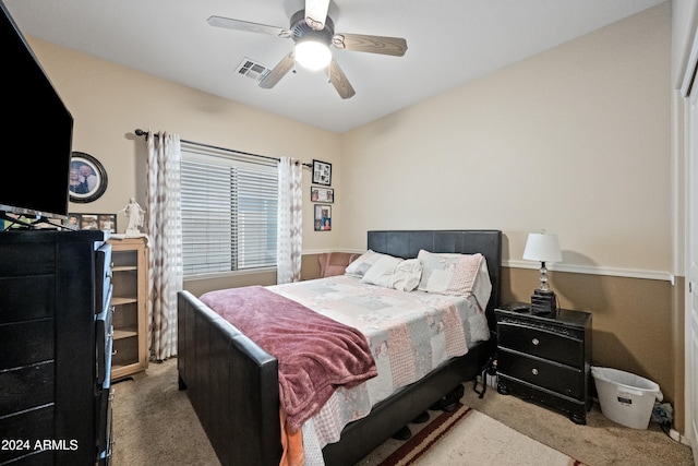 bedroom featuring ceiling fan, visible vents, and carpet flooring