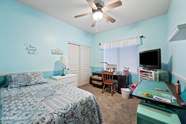 carpeted bedroom with a ceiling fan and a closet