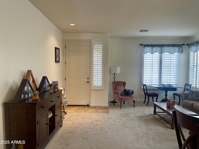 entrance foyer featuring recessed lighting, baseboards, visible vents, and light colored carpet