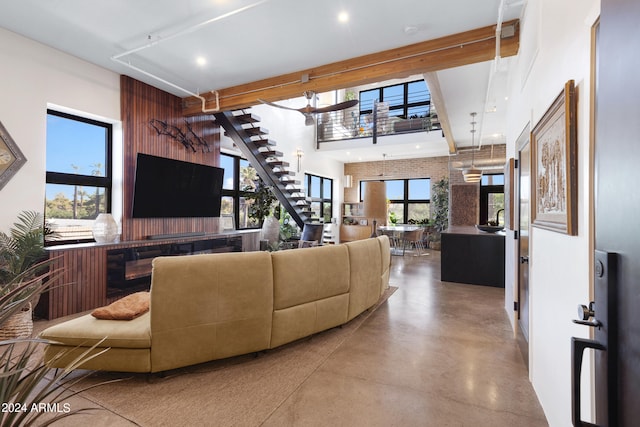 living room with concrete floors and plenty of natural light