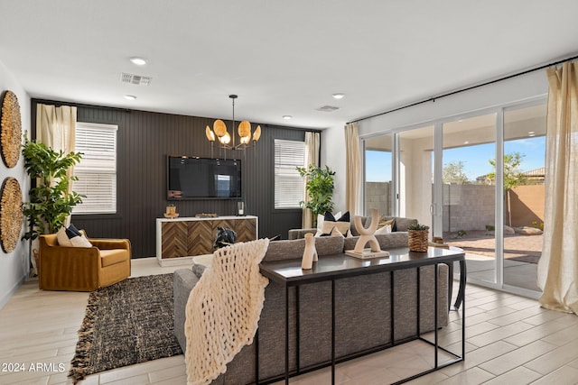 7333 W Buckhorn Trl, Peoria, AZ 85383 - living area featuring plenty of natural light, a chandelier, light wood-style floors, and recessed lighting