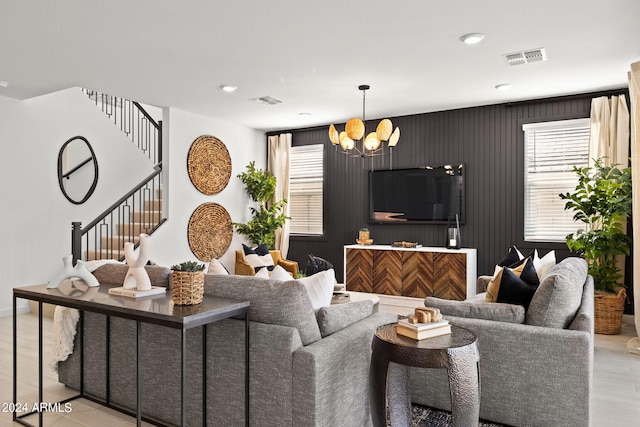 7333 W Buckhorn Trl, Peoria, AZ 85383 - living room with a chandelier, stairs, light wood-style floors, recessed lighting, and baseboards