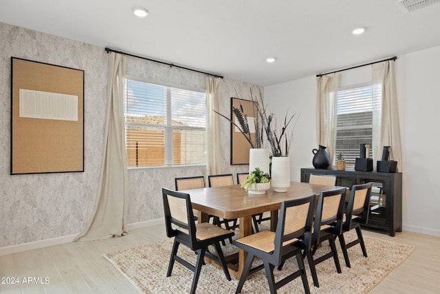 7333 W Buckhorn Trl, Peoria, AZ 85383 - dining area featuring wallpapered walls, light wood-type flooring, baseboards, plenty of natural light, and recessed lighting