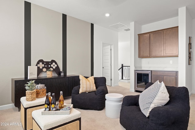 7333 W Buckhorn Trl, Peoria, AZ 85383 - living area featuring beverage cooler, light carpet, and baseboards