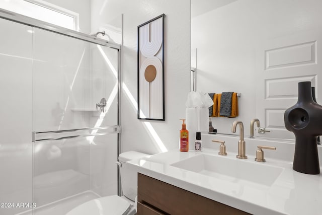7333 W Buckhorn Trl, Peoria, AZ 85383 - bathroom featuring toilet, vanity, and a stall shower