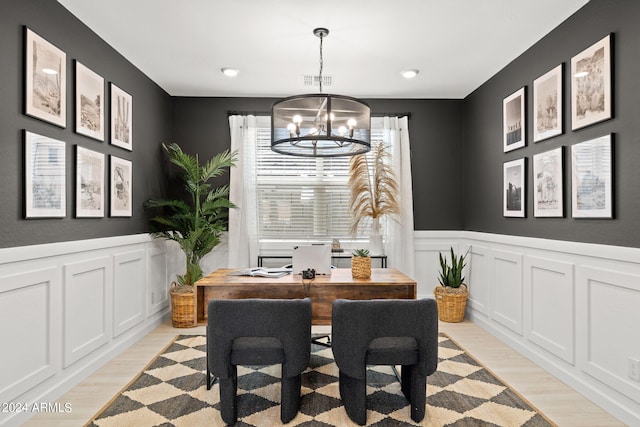 7333 W Buckhorn Trl, Peoria, AZ 85383 - dining area with a chandelier, light wood-style floors, wainscoting, a decorative wall, and recessed lighting