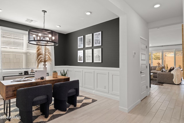 7333 W Buckhorn Trl, Peoria, AZ 85383 - dining area featuring wainscoting, light wood-style flooring, a chandelier, recessed lighting, and an office area