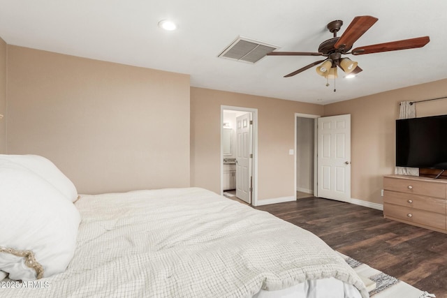 bedroom featuring ceiling fan, dark hardwood / wood-style flooring, and ensuite bathroom