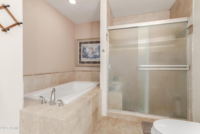 bathroom featuring toilet and shower with separate bathtub