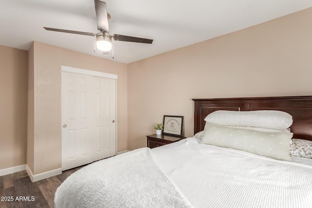 bedroom featuring ceiling fan, dark hardwood / wood-style flooring, and a closet