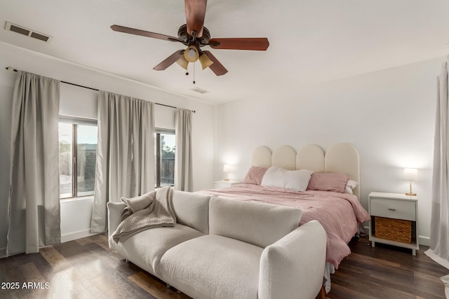 bedroom with ceiling fan and dark hardwood / wood-style flooring