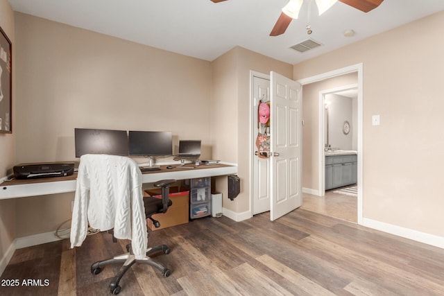 office space featuring ceiling fan and hardwood / wood-style floors