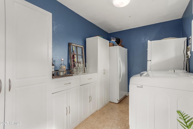 laundry room with light tile patterned floors