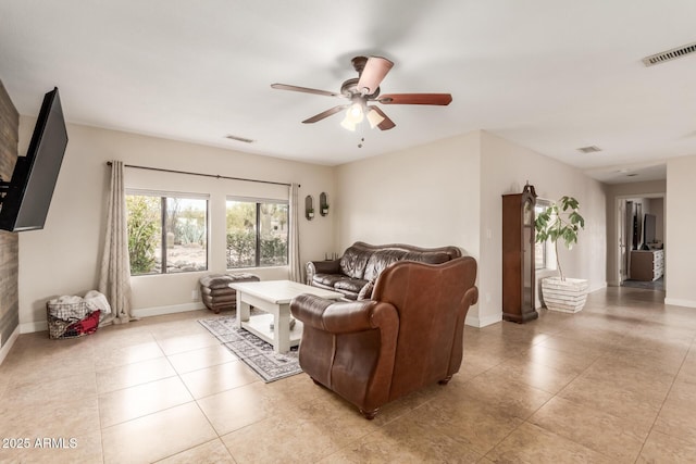 tiled living room with ceiling fan