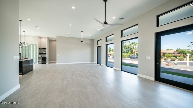 bar with backsplash and stainless steel fridge