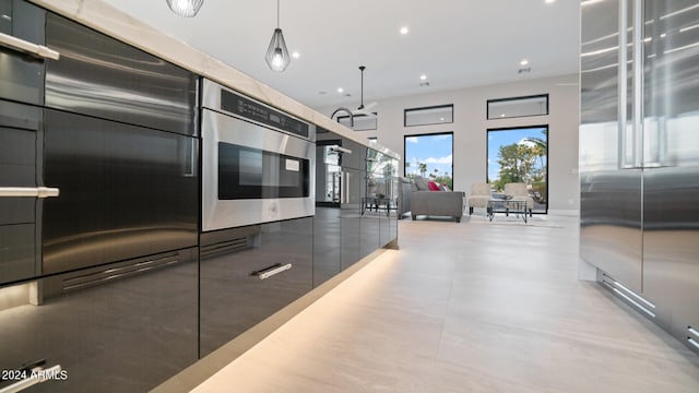 kitchen featuring pendant lighting and high end refrigerator