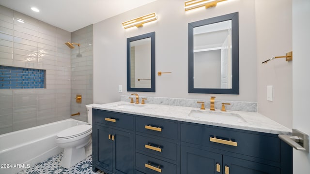 full bathroom featuring vanity, toilet, tile patterned floors, and tiled shower / bath